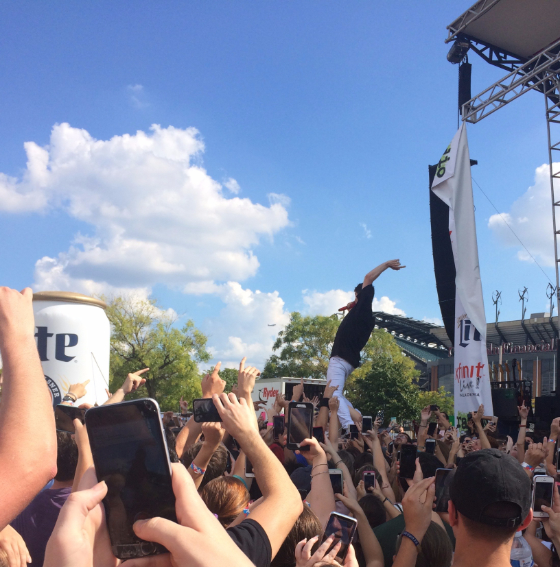 New Politics performing at Xfinity Live! in Philadelphia walks on crowds hands.